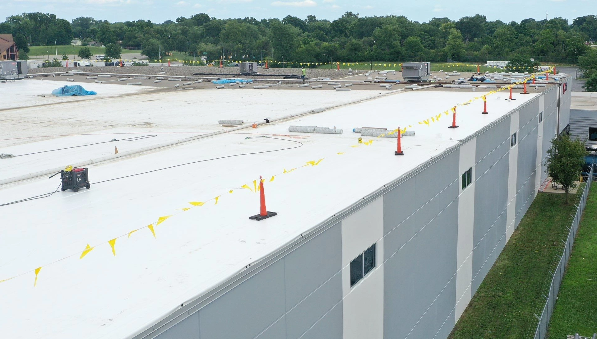 Aerial view of a distribution center with a new white durolast roof