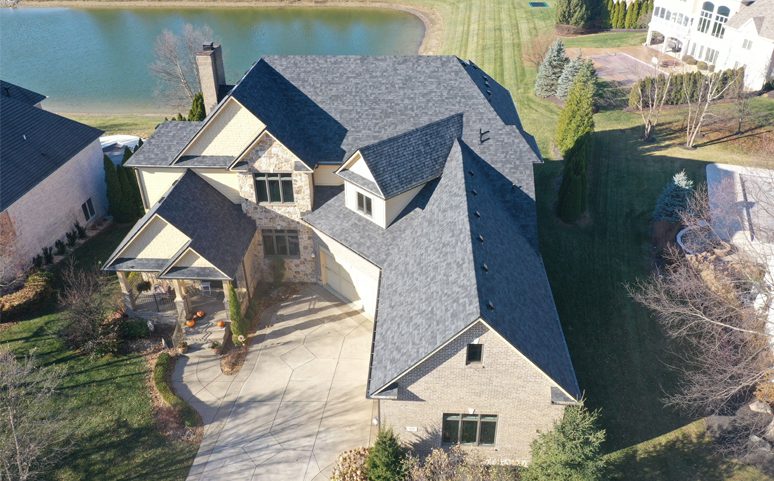 image of a suburban home with roofing by a contractor